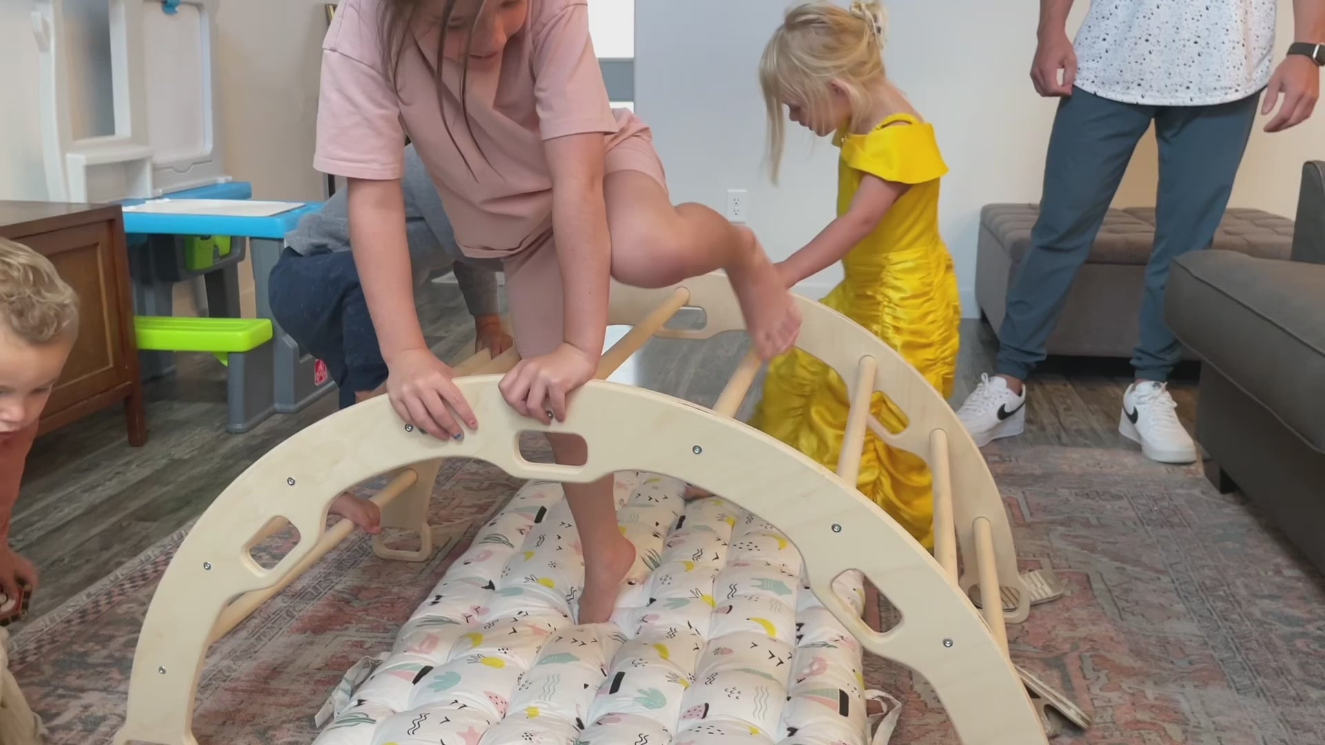 Child playing on the Wooden Climbing Arch Rocker