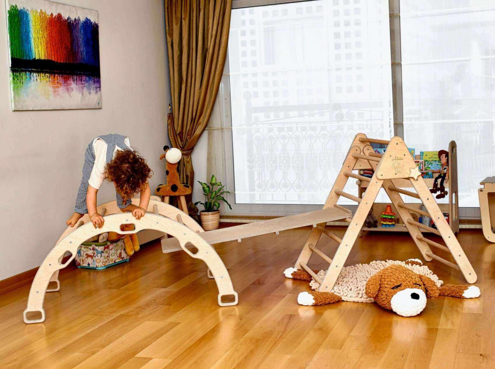 Indoor climbing playground set with a climbing triangle, climbing arch, rockwall slide ramp, and jungle gym for active play.