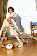 Child climbing on the Montessori Triangle Climber - Kidodido