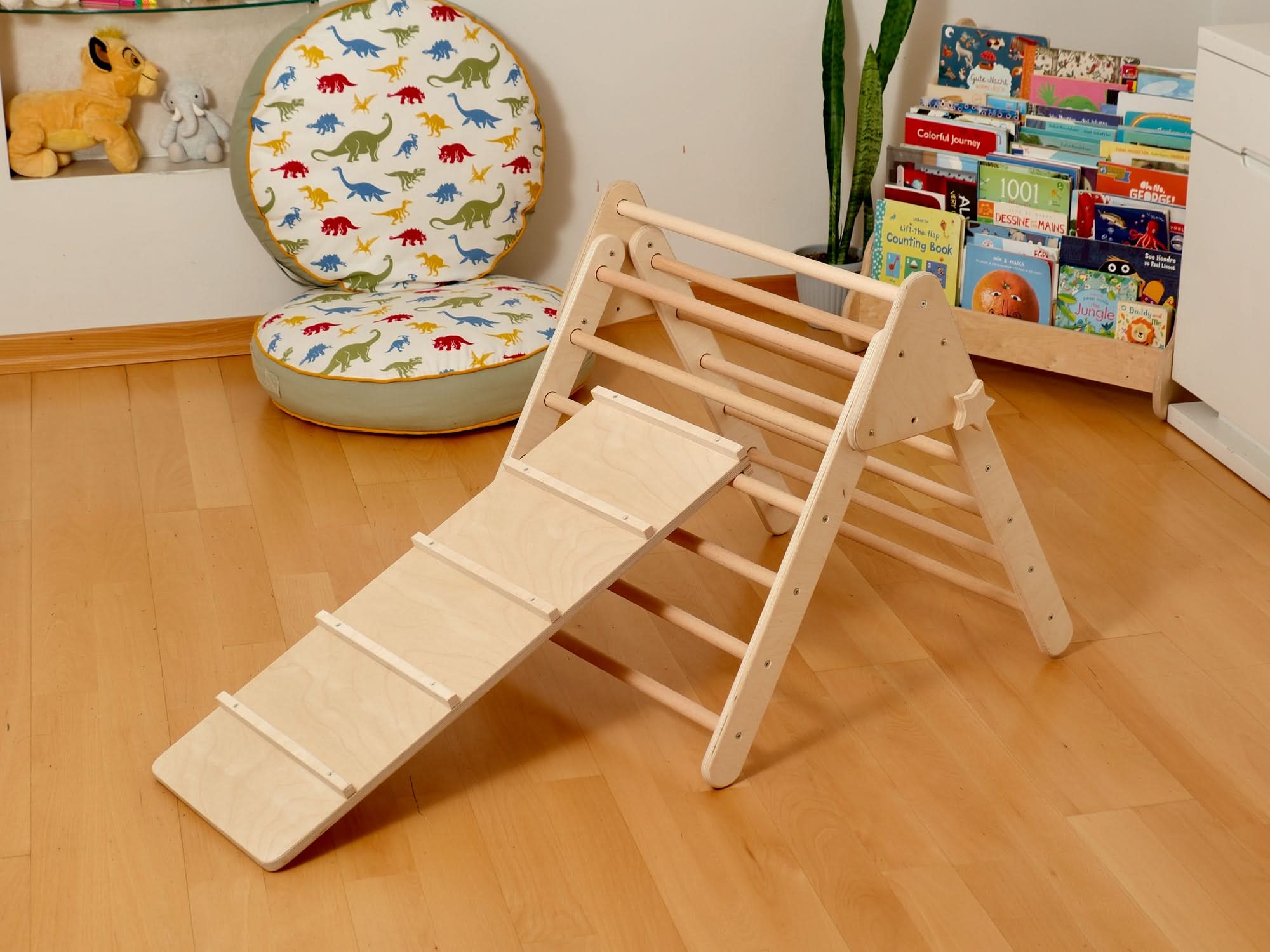Montessori indoor playground set featuring a Pikler triangle, climbing arch, and slide for toddler fun.