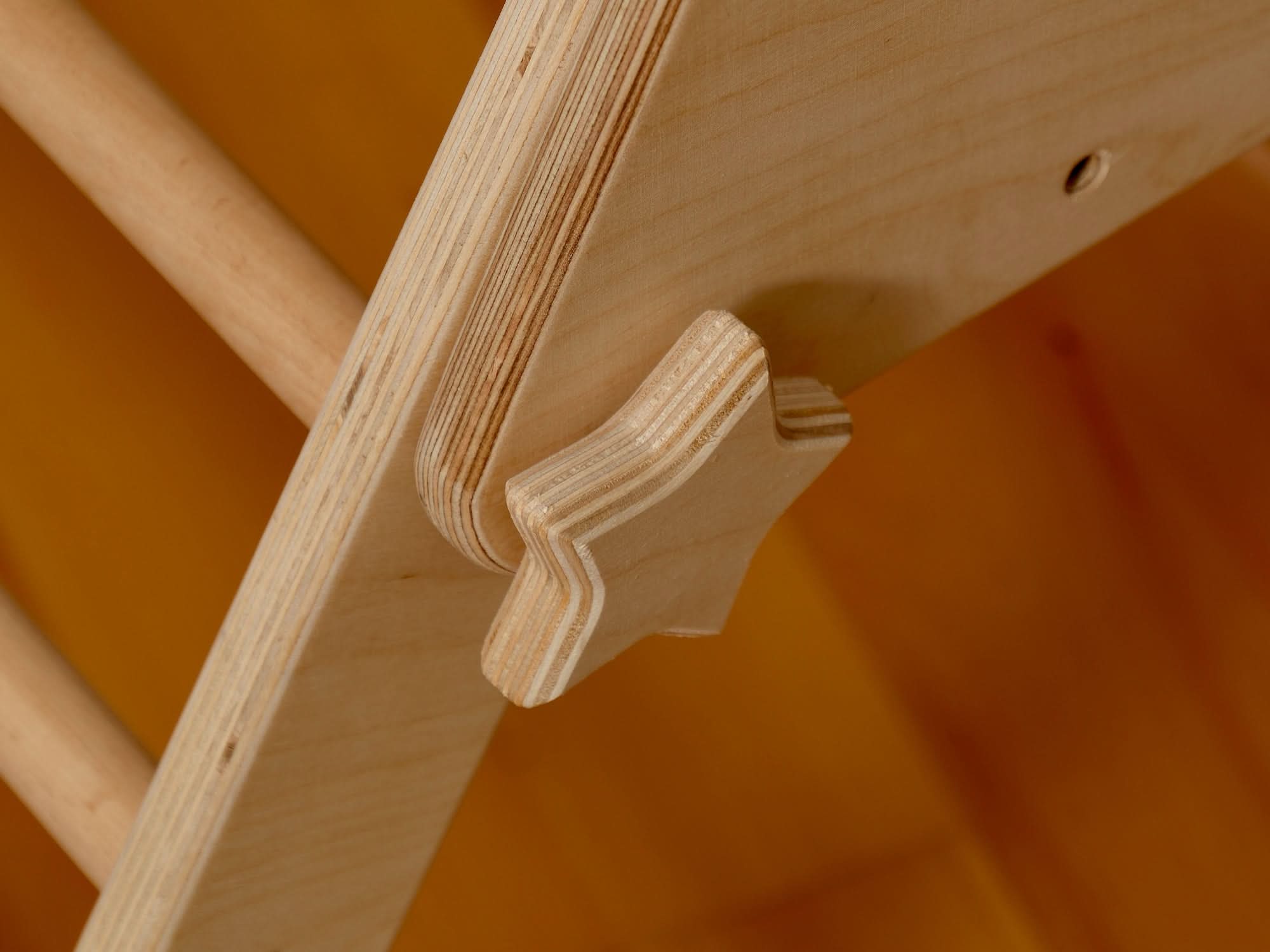 Close-up of a wooden Pikler triangle connector, highlighting craftsmanship in Montessori climbing sets.