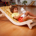 Child relaxing on the Adjustable Lounge Chair - Kidodido