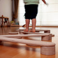 Child playing on the Balance Beam - Kidodido