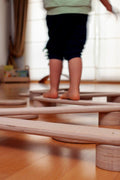 Child playing on the Balance Beam - Kidodido