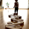 Child playing on the Balance Beam and Stepping Stones