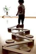 Child playing on the Balance Beam and Stepping Stones